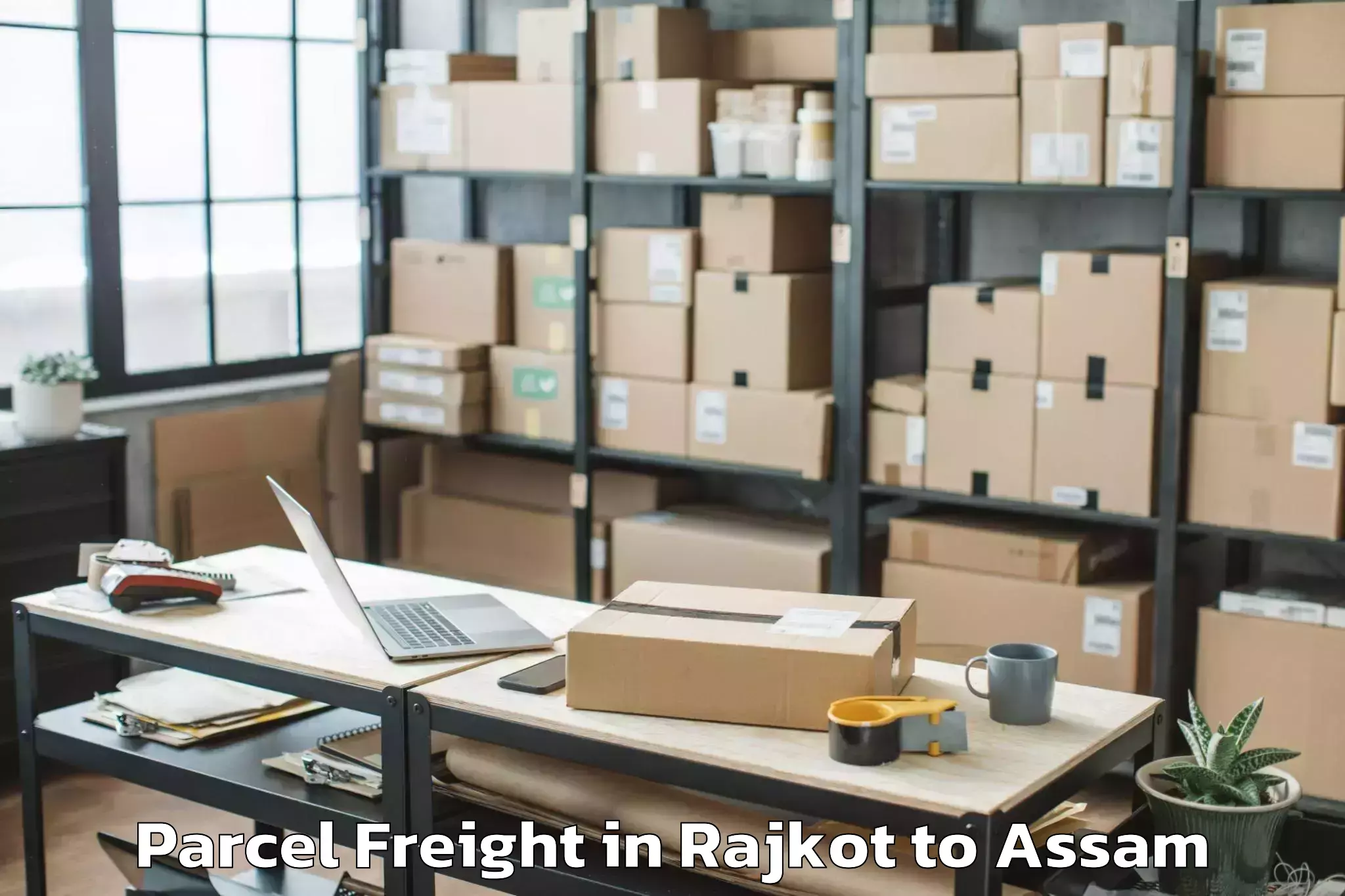 Easy Rajkot to Khoirabari Pt Parcel Freight Booking